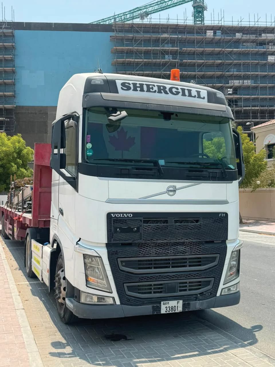 White Shergill Volvo FH heavy truck at a construction site in Dubai