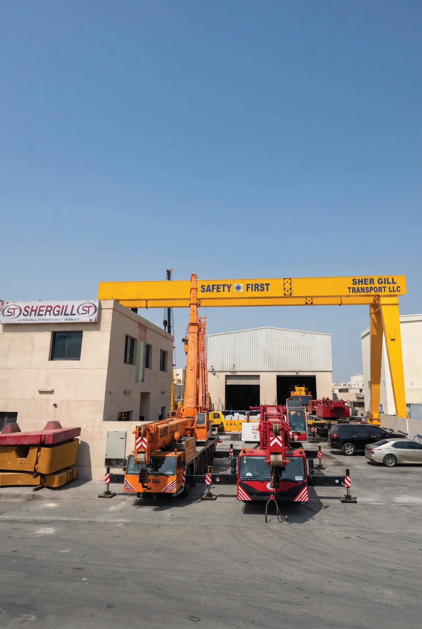 Shergill Transport L.L.C equipment yard in Jebel Ali Industrial Area with gantry crane and mobile cranes