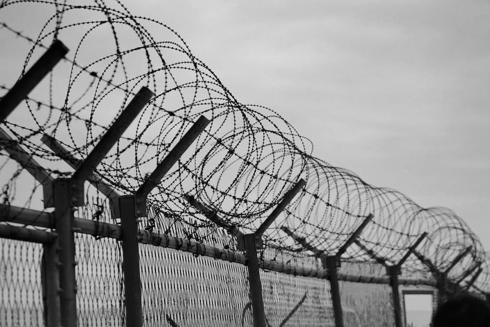 Security fencing with barbed wire around a project site