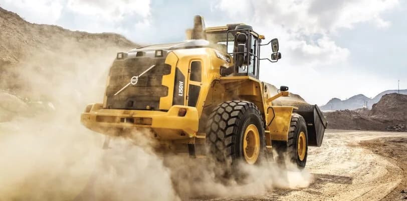 Wheel loader working on a dusty earthmoving site